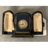 A miniature travelline Timepiece with blue enamel case retailed by Harrods 3.75 cm H leather