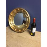 Small circular Captains mirror, with ball finials, 27cm diameter overall