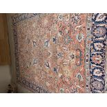 Traditional old Persian carpet, terracotta ground and blue multi border