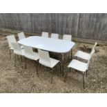 Ikea modern white moulded and chrome table 180L x 100 w and Set of 10 chairs. Condition sound some