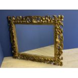 C19th giltwood oblong wall mirror, with a rococo scrolling frame, with shell finial, the plate is 67