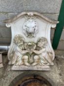 Large white painted moulded concrete wall plaque with lion mask fountain head raised on a sink well