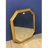 Octagonal wall mirror set within gilt wood style frame 68 x 57cm