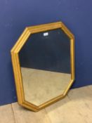 Octagonal wall mirror set within gilt wood style frame 68 x 57cm