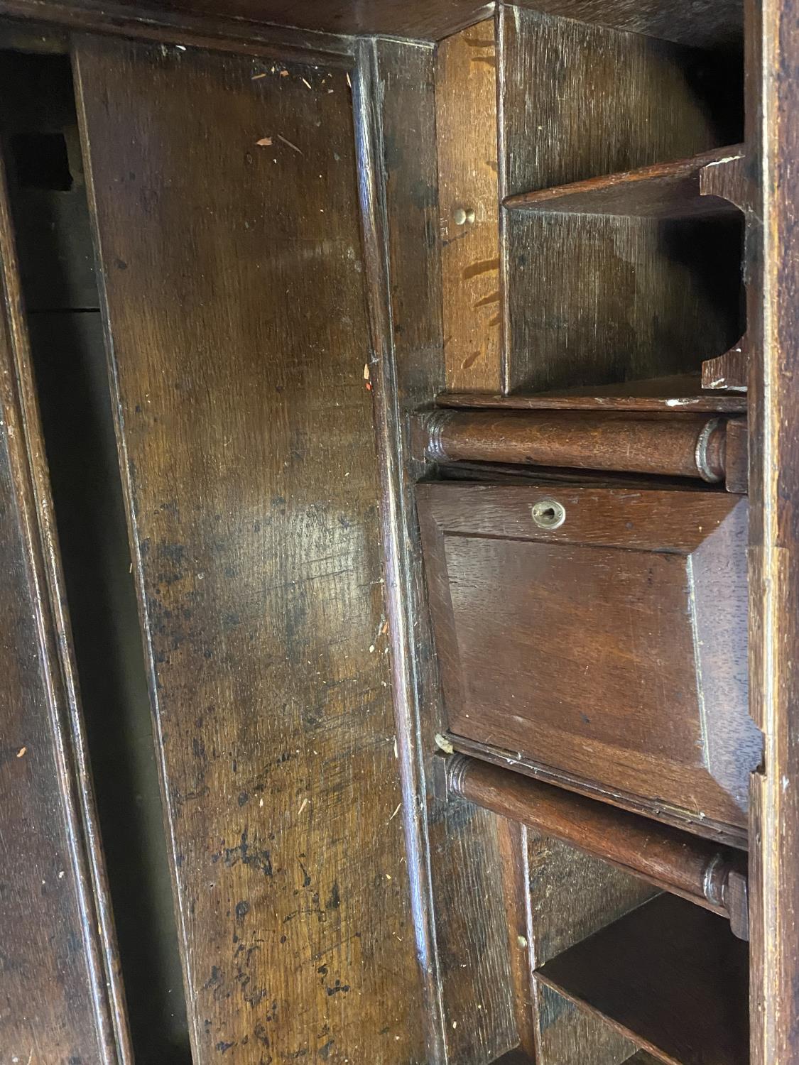 C18th oak bureau of 2 short over 2 long drawers with stepped fitted interior around a well with - Image 4 of 5