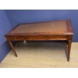 De Gournay mahogany writing table of 3 drawers and turned tapered legs below a brown leather inset
