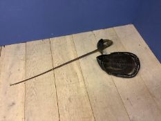 A fencing helmet and a fencing sword