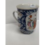 Chinese early C18th blue and white porcelain pint mug with famille vert and famille rose mandarin