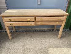 Good quality modern light oak side table of 4 moulded drawers 170cm L x 53 cm W x 81 cm H. Condition