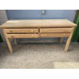 Good quality modern light oak side table of 4 moulded drawers 170cm L x 53 cm W x 81 cm H. Condition