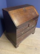 C18th oak bureau of 2 short over 2 long drawers with stepped fitted interior around a well with