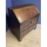 C18th oak bureau of 2 short over 2 long drawers with stepped fitted interior around a well with