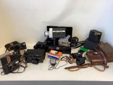 A quantity of cameras and binoculars to include Nikon, Canon, Nikon cam corder, Pocket Fujica,