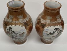 A pair of Japanese C19th Kutani porcelain vases 25 cm H One with a glued crack to the neck