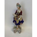C19th porcelain figure of an elegant lady carrying a basket of fruit 20 cm H blue C19th Sitzendorf