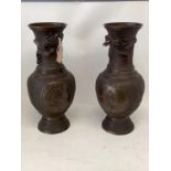 Pair Chinese bronze vases, possibly late Qing dynasty with relief ground and panels of mythical