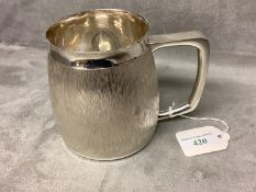 A modern design silver pint mug, the bark pattern of Gerald Benney for C J Vander Ltd London 1973