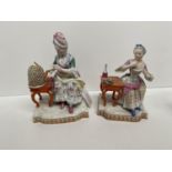 A pair of early C19th Meissen porcelain seated ladies 14 cm H One with chip to underside of base