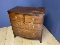 Small Victorian mahogany bow front chest of 2 short over 2 long drawers with brass drop handles