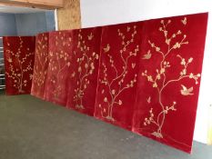 A set of 6 velvet upholstered wall panels with gold thread decoration of birds and branches,