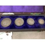 Leather case of four 1875 Maundy Coins