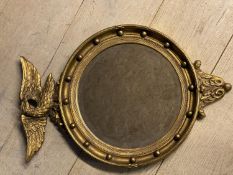 Circular bevelled glass Captains mirror, with eagle finial, 68 x 46cm