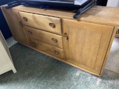 Good Quality 1960s Scandinavian style light hardwood low cabinet of 3 drawers flanked by cupboards