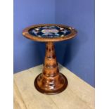 Circular pedestal table with butterfly inset decoration to top
