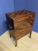 Regency ebony inlaid mahogany cellarette on tapered square legs to brass casters with side handles