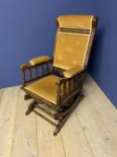 Traditional American style spring base rocking chair upholstered in lemon draylon. Condition sound