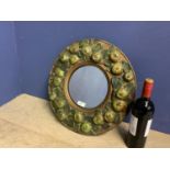 Early C20th Circular wall mirror, set within wooden frame, decorated with carved wood apples, 43cmd
