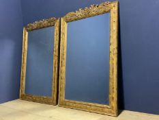 Pair carved gilt wood decorated oblong bevelled wall mirrors 110 x 76 overall. Condition good.