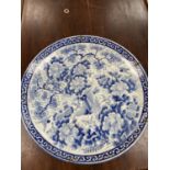 A C19th blue and white charger, 55cm diam approx.