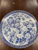 A C19th blue and white charger, 55cm diam approx.