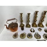 Quantity of antique & later copper & brass wares including horse brasses, candlesticks etc.