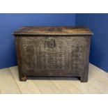 C18th heavy oak coffer the entire front intricately carved and with plain panelled sides. 113 cm L x