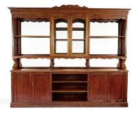 A late 19th century French mahogany and stained pine Baker's shop fitting 275cm wide, 34cm deep,