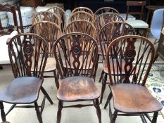 12 Early Victorian elm wheelback Windsor chairs. Condition: General wear, some old worm holes, 1