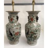 Pair of Chinese stoneware lamp bases, polychrome, decorated with birds and flowers, marks to base