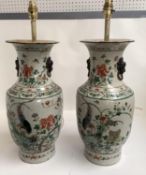 Pair of Chinese stoneware lamp bases, polychrome, decorated with birds and flowers, marks to base