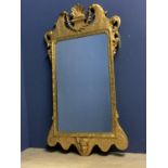 Late C18th giltwood and gesso wall mirror with oblong shallow bevelled plate 75 x 46 with an