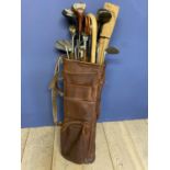 Vintage golf clubs in leather bag - all worn