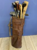 Vintage golf clubs in leather bag - all worn