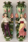 Pair of Art Nouveau period majolica tall vases, decorated with two figures, generally good