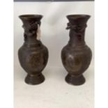 Pair Chinese bronze vases, possibly late Qing dynasty with relief ground and panels of mythical