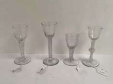 Four Georgian wine glasses, one with air twist stem and chip to foot 16cm, another with facetted