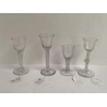 Four Georgian wine glasses, one with air twist stem and chip to foot 16cm, another with facetted