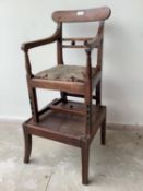 William IV child's mahogany high chair raised on a play table. Condition: Foot rail to chair