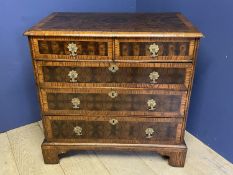 Fine oyster veneer and cross banded C18th chest of 2 short and 3 long graduated drawers (with