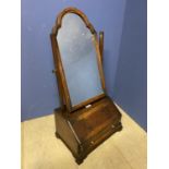 George III crossbanded walnut toilet mirror with arched top supported on a fitted bureau base on